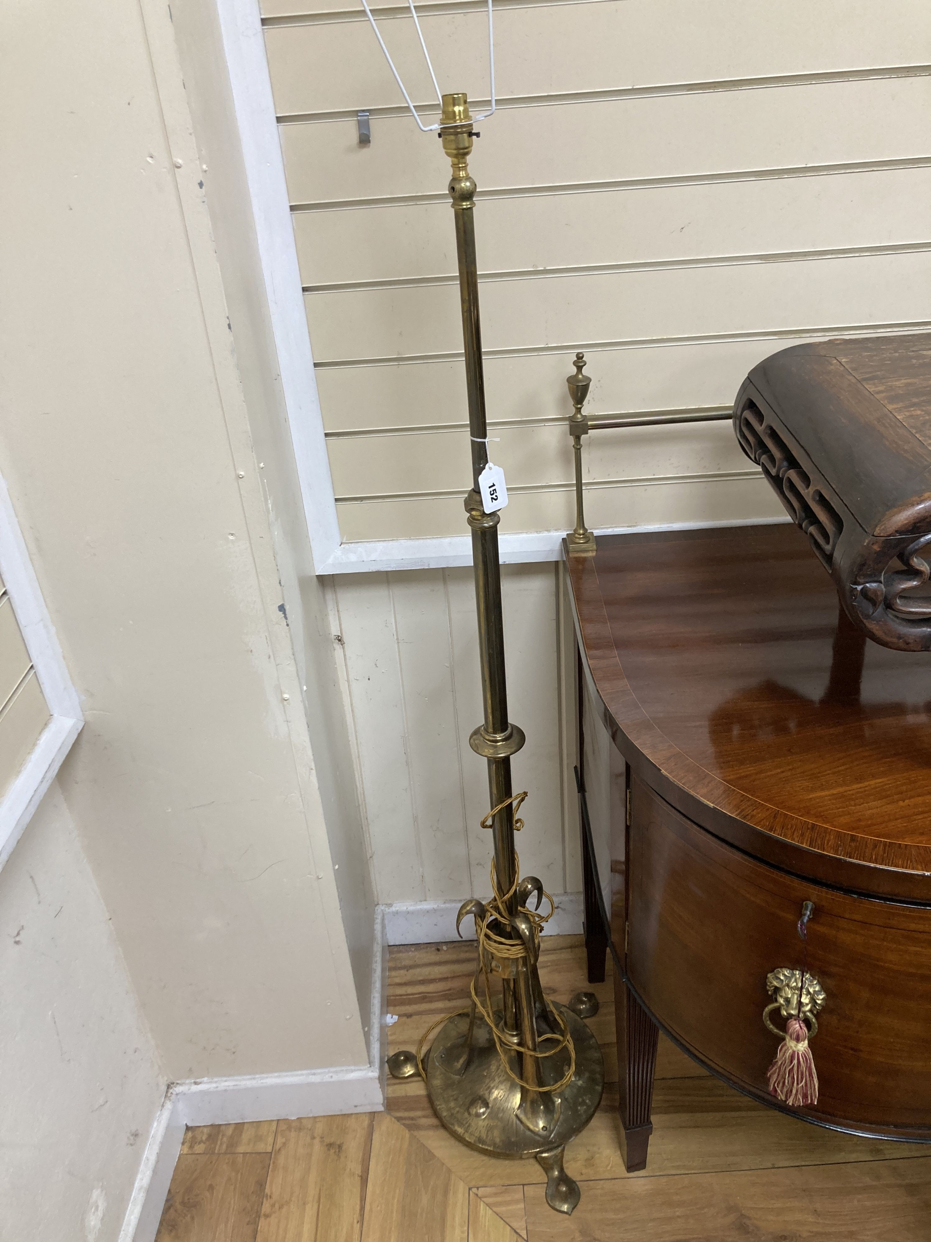 An Arts and Crafts brass telescopic standard lamp.